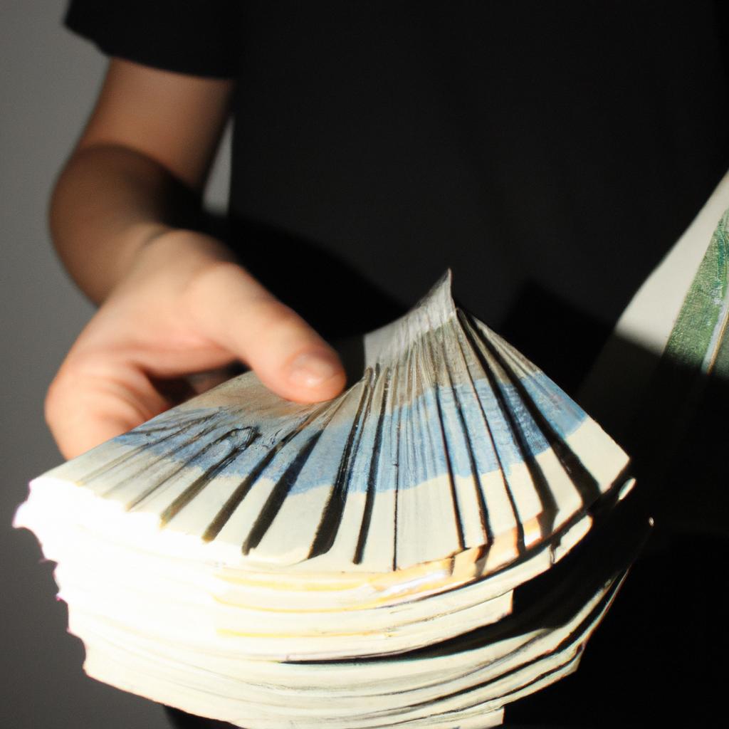 Person holding stack of money
